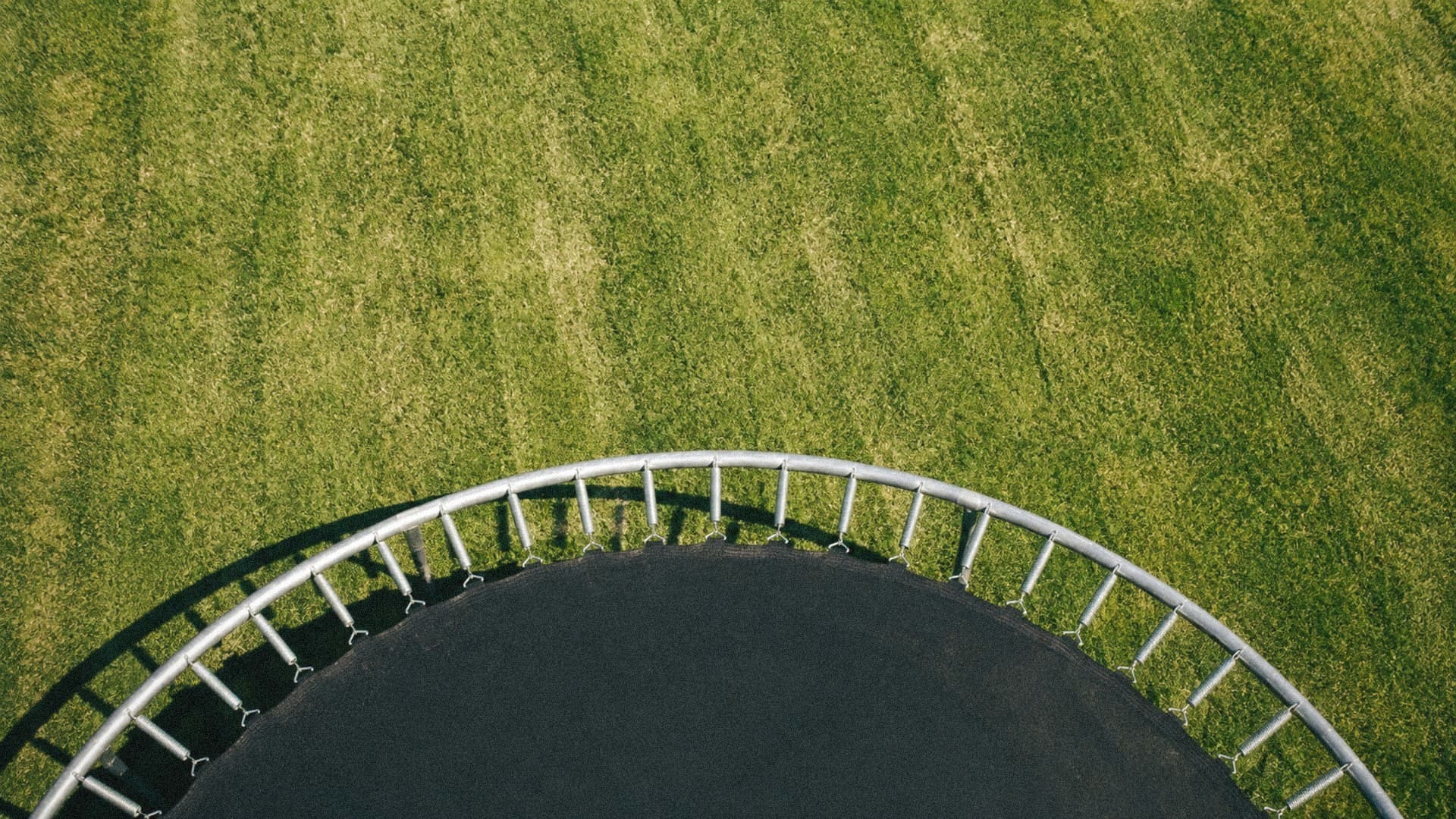 Overhead view of a trampoline mat and springs ready for replacement in Auckland